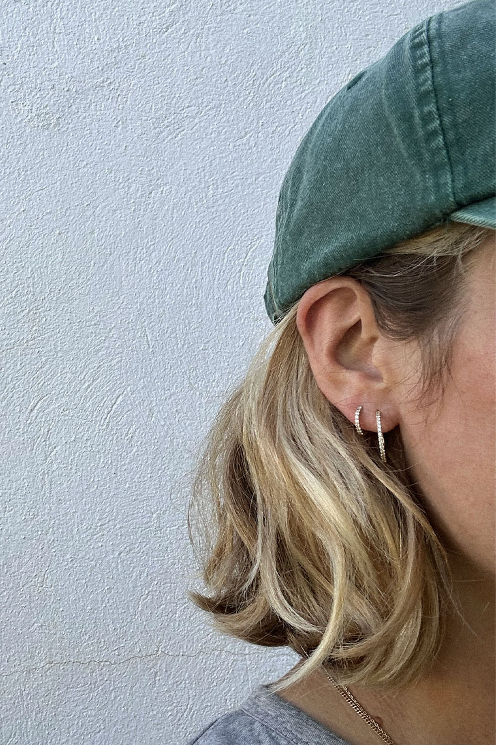 The "Mini Bling Diamond Hoop" 18K Solid Gold earrings with diamonds